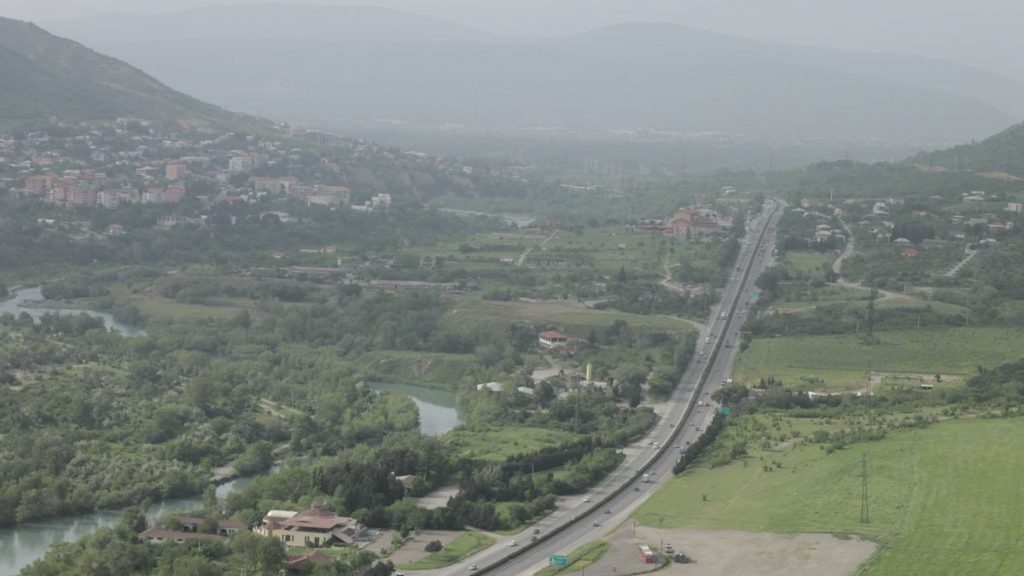 an aerial view of a city and a river