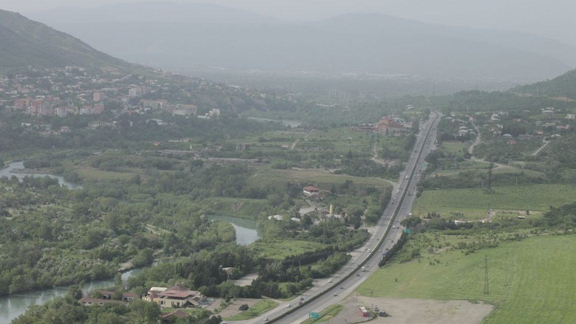 an aerial view of a city and a river