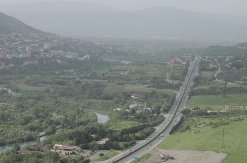 an aerial view of a city and a river